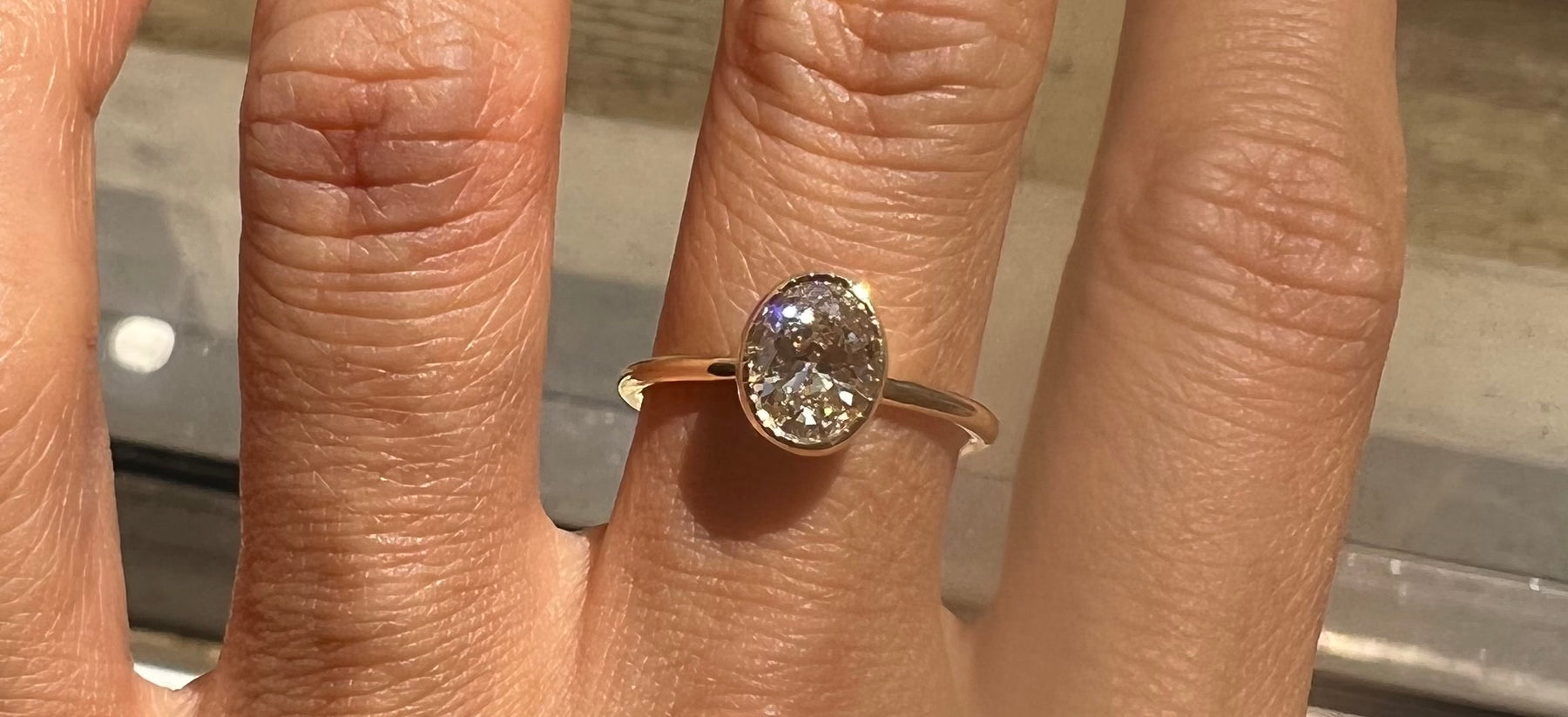 14k yellow gold custom engagement ring with solitaire oval diamond center stone