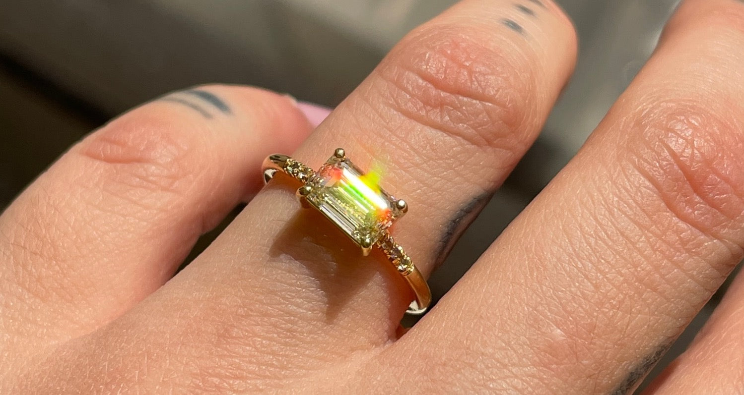 14k yellow gold custom engagement ring with east west diamond center stone and pave diamonds