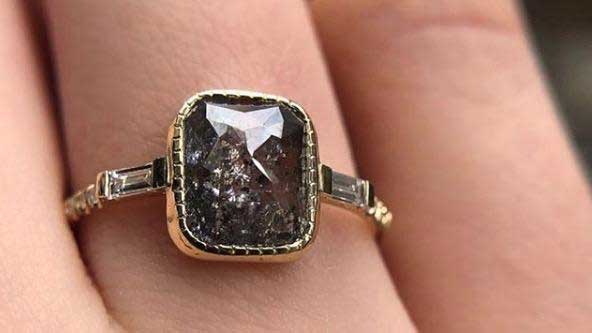 14k yellow gold custom ring with rustic square diamond center stone and milgrain detail and white diamond baguettes