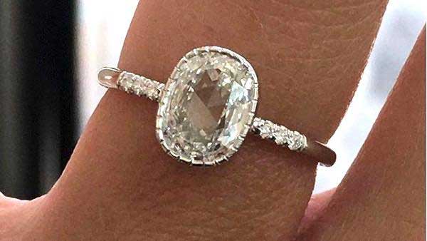 14k yellow white custom engagement ring with round cut center stone milgrain detail and white diamond pave equilibrium stones