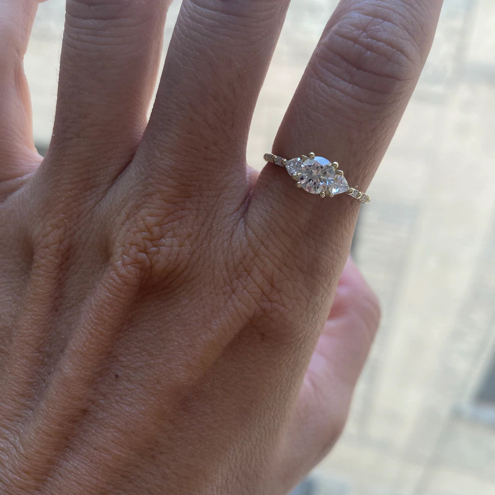 14k yellow gold custom engagement ring with marquise cut white diamond center stone with pave white diamonds