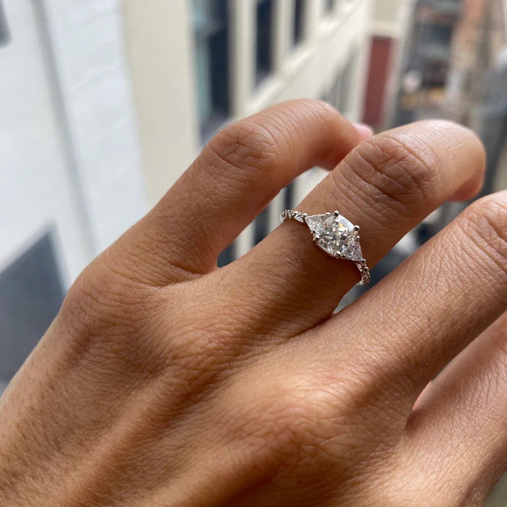 14k yellow gold custom engagement ring with white diamond center stone with pave white diamonds on hand