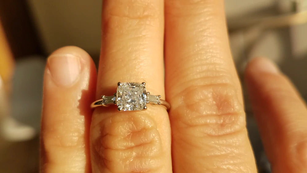 14k yellow gold engagement ring with round white diamond center stone