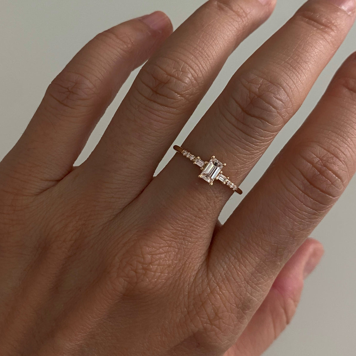 EMERALD CUT DIAMOND MELODY RING