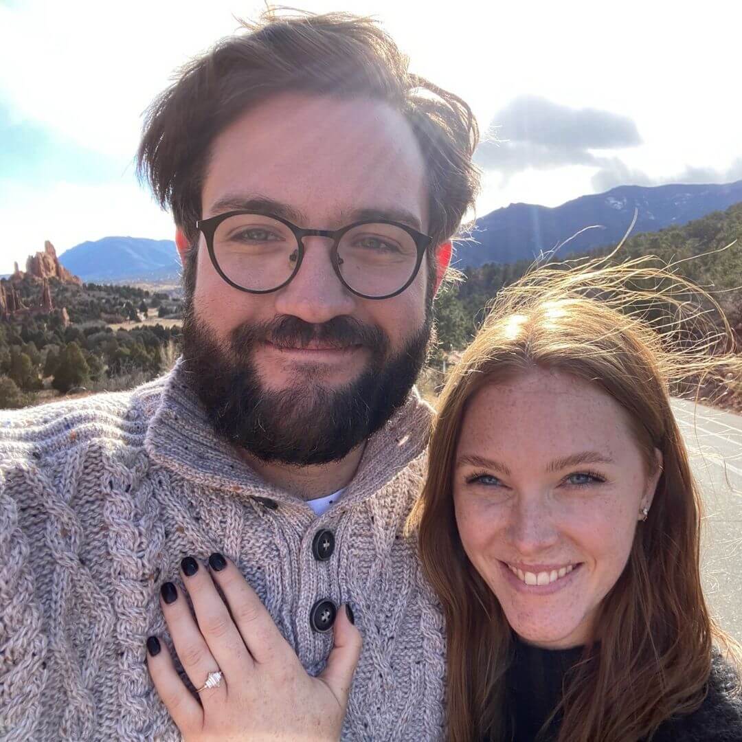 couple wearing engagement ring