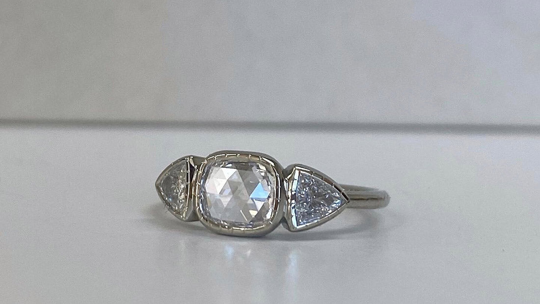 14k white gold custom ring with square white diamond center stone and pepper triangle side stones