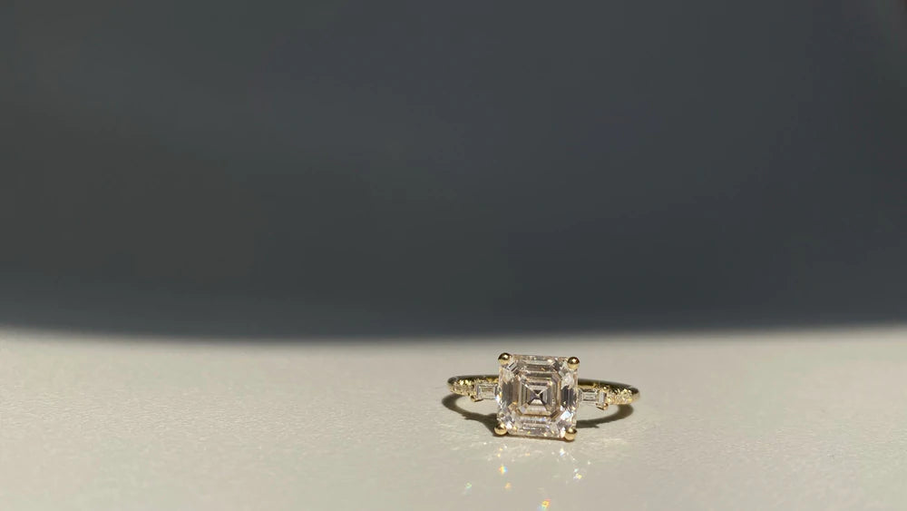 14k yellow gold custom engagement ring with princess cut white diamond center stone