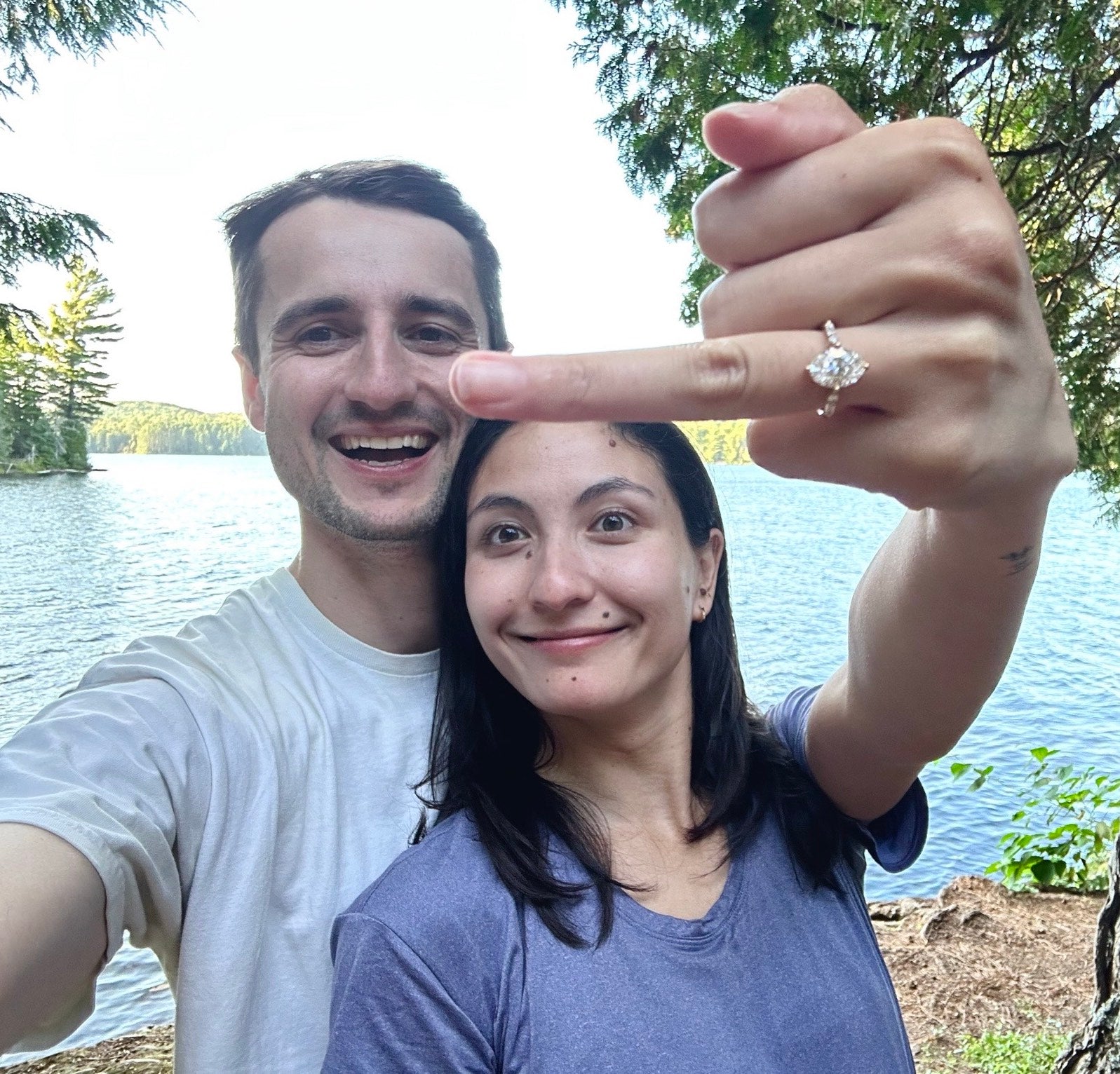 couple wearing engagement ring