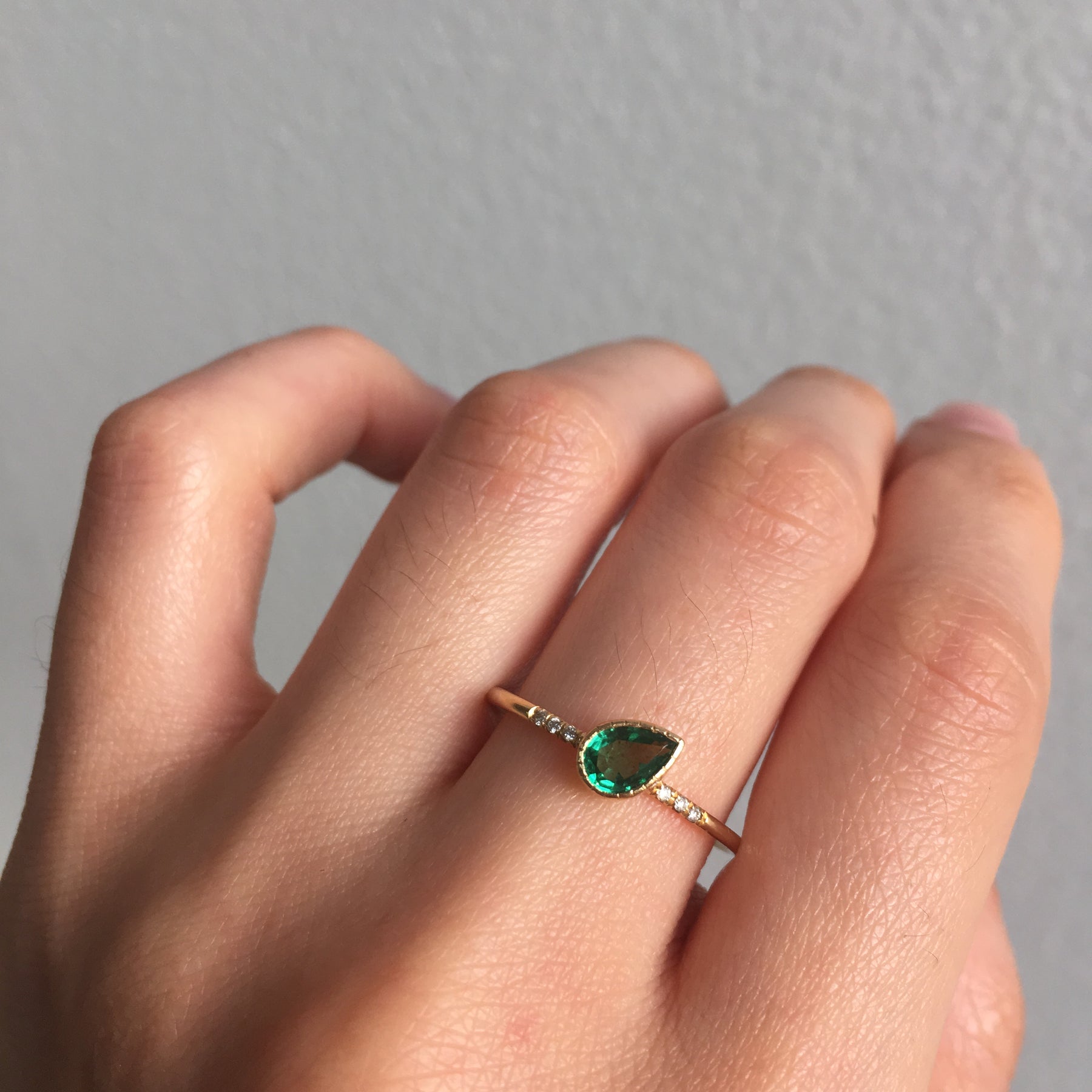 Emerald Tilt Equilibrium Ring