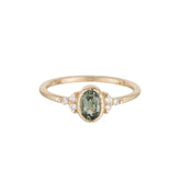 oval green sapphire cluster ring
