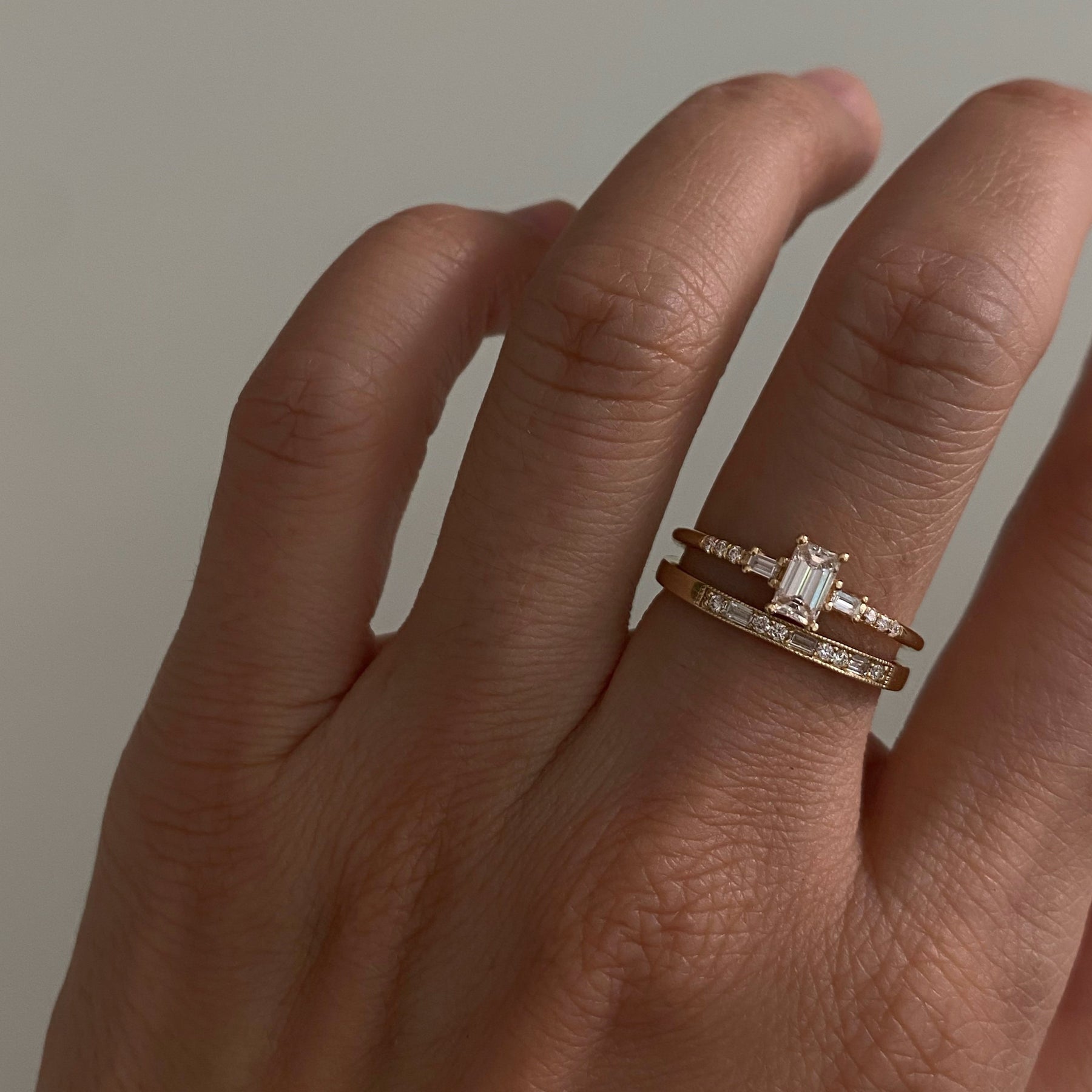 EMERALD CUT DIAMOND MELODY RING